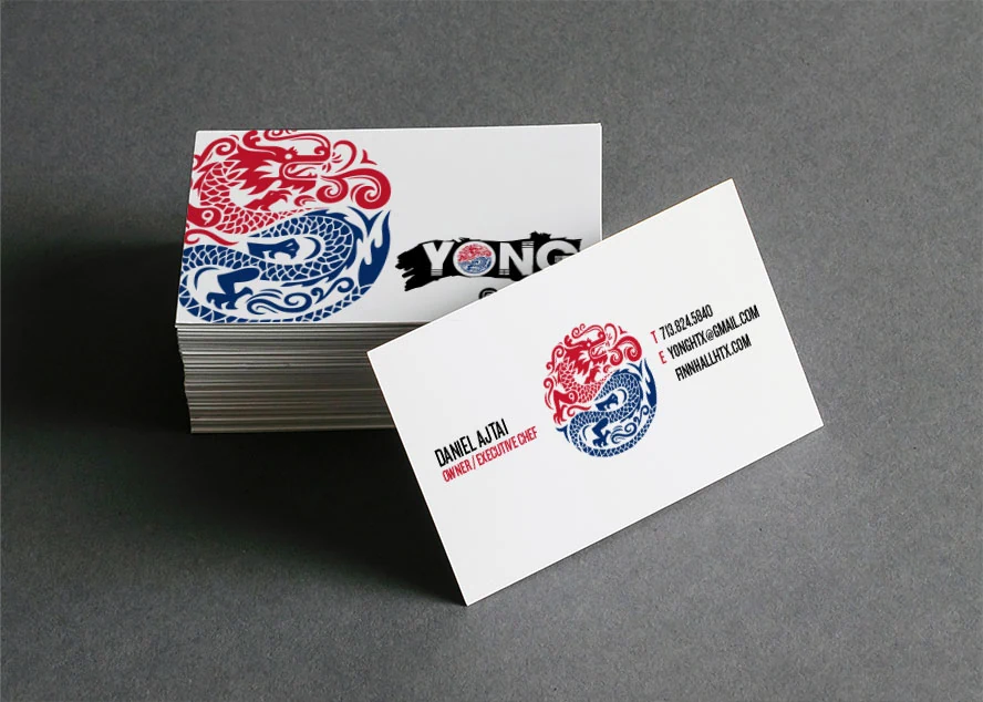YONG business cards with red and blue dragon medallion
